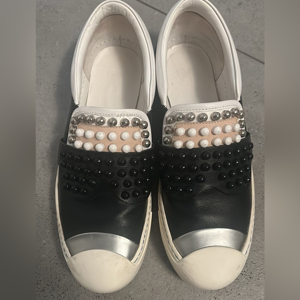FENDI
Calfskin Studded Karlito Slip On